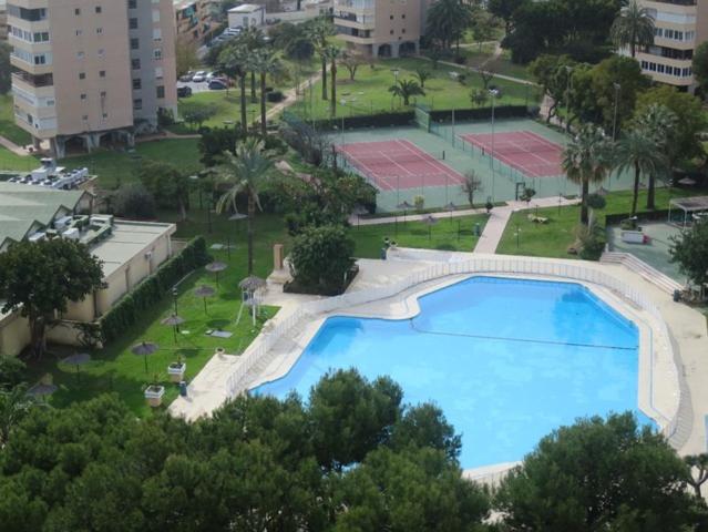 an overhead view of a large swimming pool in a city at Oasis Playamar in Torremolinos