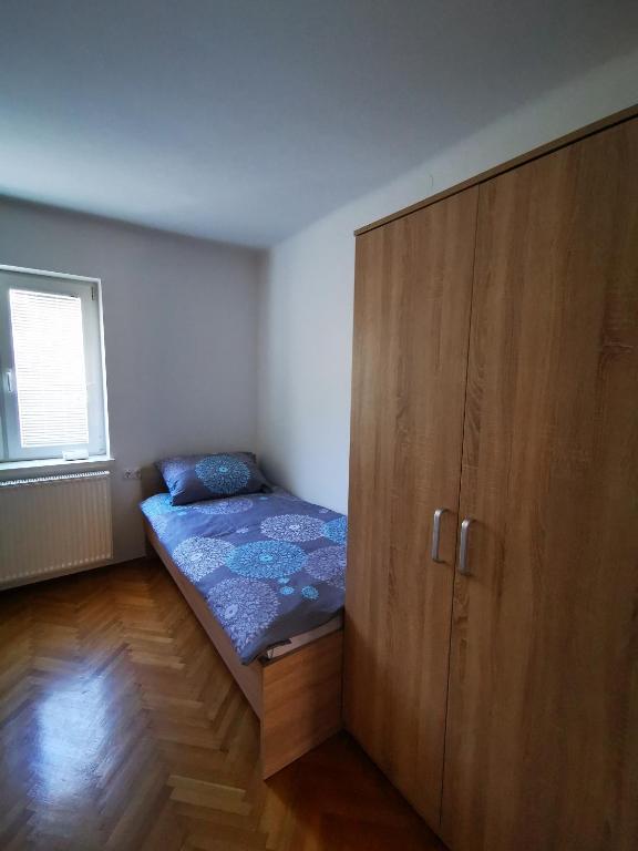 Postel nebo postele na pokoji v ubytování Apartmaji Tomšič