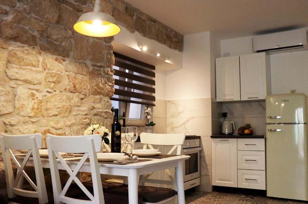Kuchyňa alebo kuchynka v ubytovaní Apartman Muracca