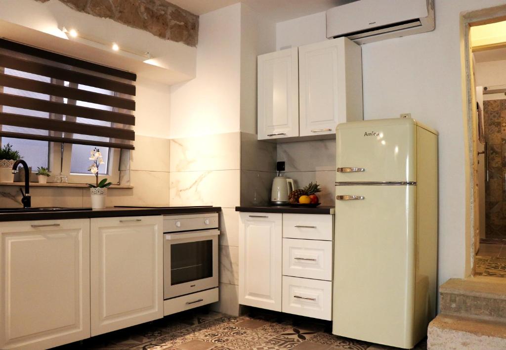 Kuchyňa alebo kuchynka v ubytovaní Apartman Muracca