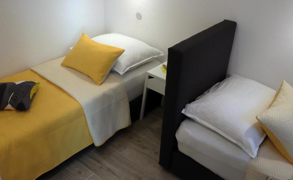 Posteľ alebo postele v izbe v ubytovaní Apartman Muracca