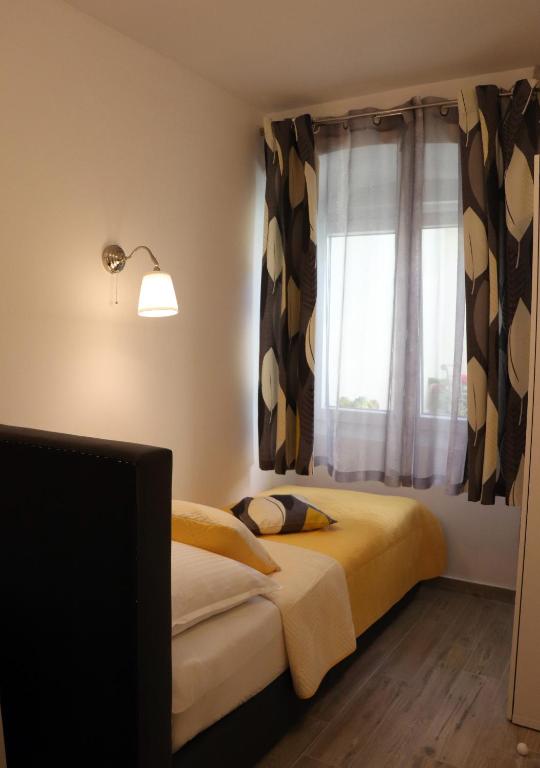 Posteľ alebo postele v izbe v ubytovaní Apartman Muracca