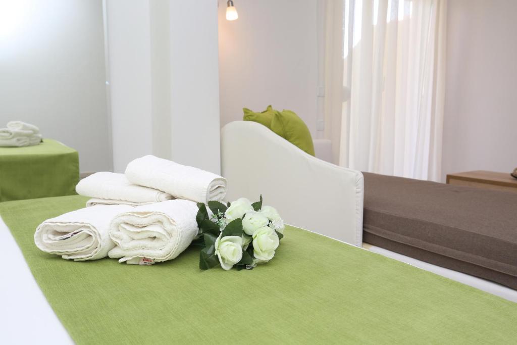 Posteľ alebo postele v izbe v ubytovaní Sun Hotel