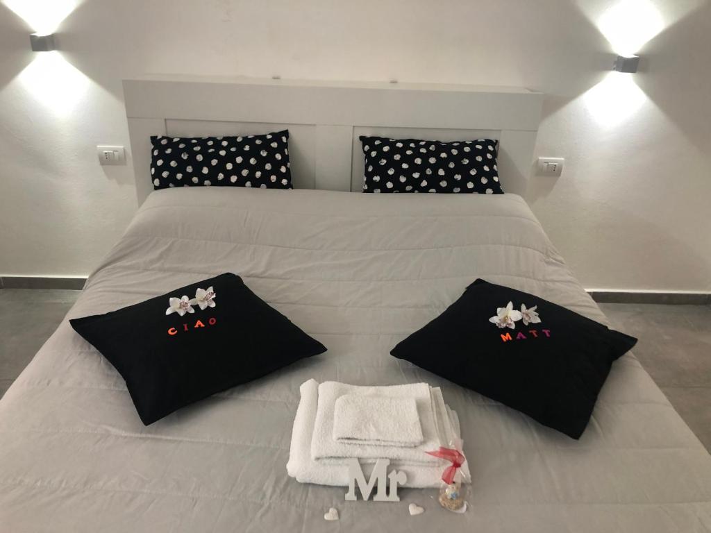 Łóżko lub łóżka w pokoju w obiekcie Casa Vacanze Antiche Mura E Poi