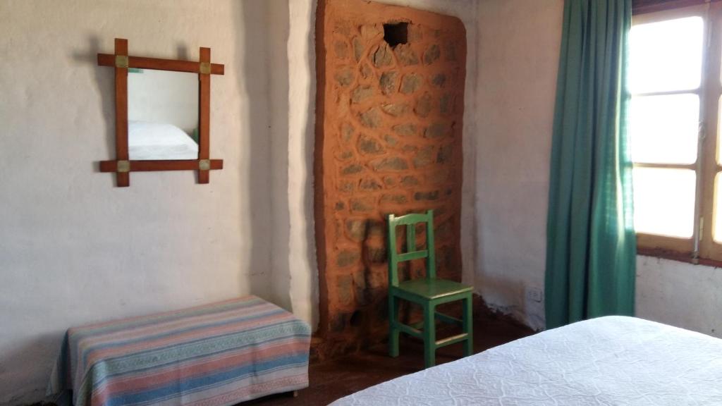 Postel nebo postele na pokoji v ubytování La Chakana