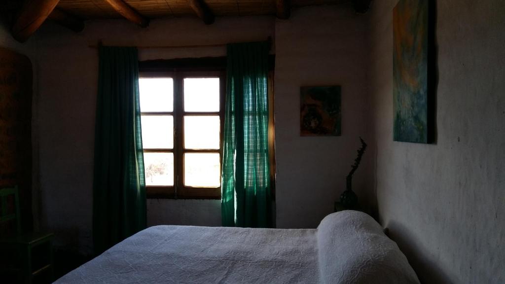 Postel nebo postele na pokoji v ubytování La Chakana