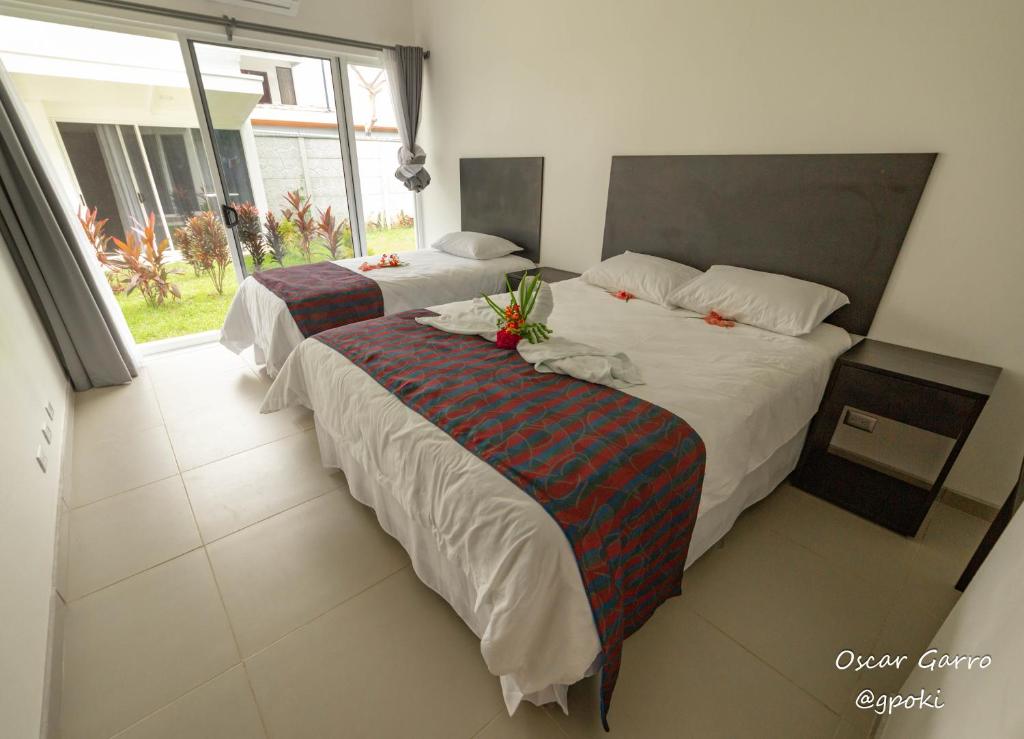 Postel nebo postele na pokoji v ubytování Uvita Paradise