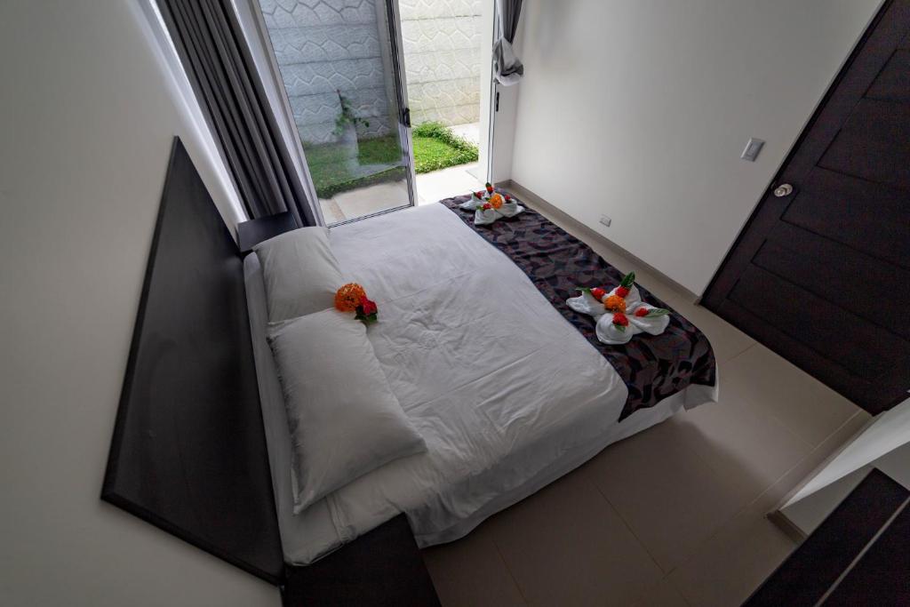 Postel nebo postele na pokoji v ubytování Uvita Paradise