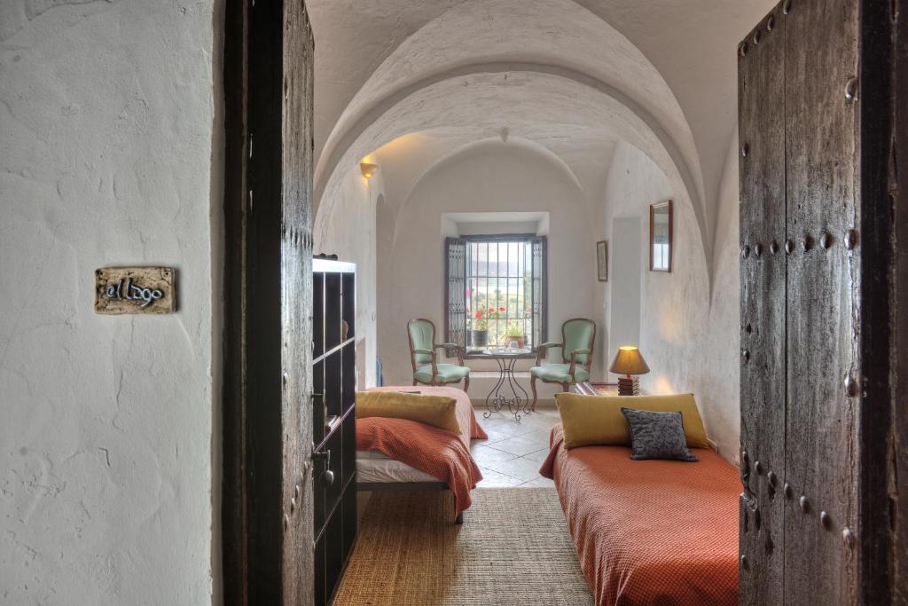Postel nebo postele na pokoji v ubytování La Casa de Bovedas Charming Inn