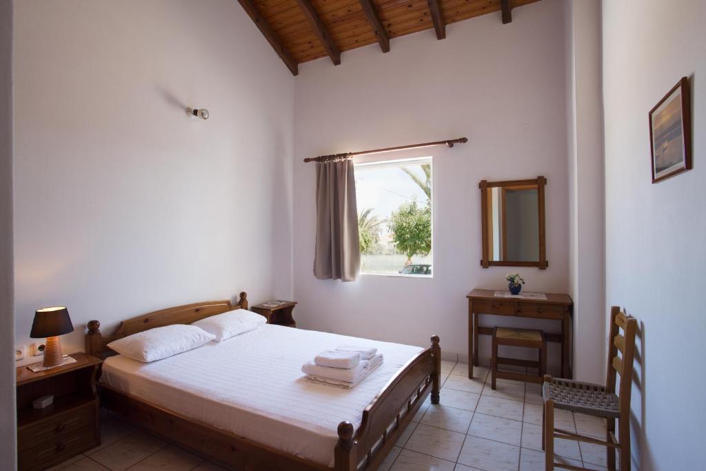 A bed or beds in a room at Ambelakia Studios