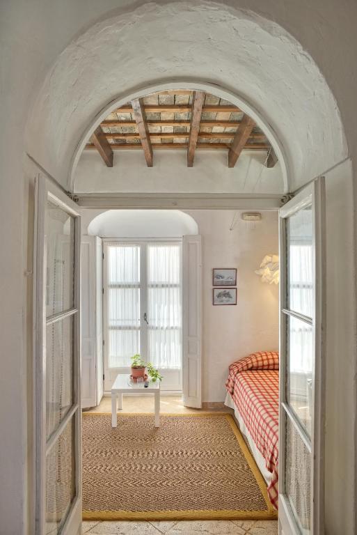 Postel nebo postele na pokoji v ubytování La Casa de Bovedas Charming Inn