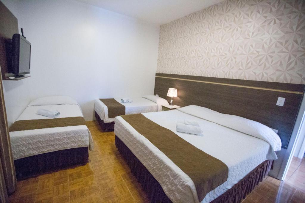 Postel nebo postele na pokoji v ubytování Hotel Vivere Cataratas