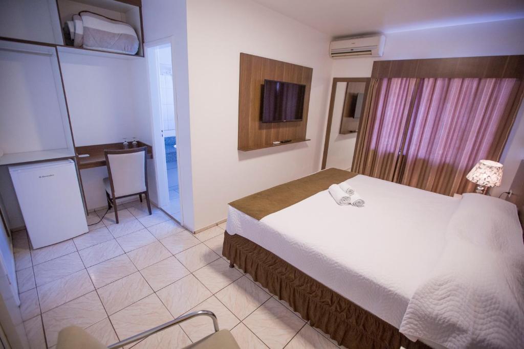Postel nebo postele na pokoji v ubytování Hotel Vivere Cataratas
