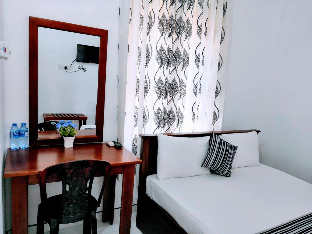 Ein Bett oder Betten in einem Zimmer der Unterkunft Bon Voyaage Tourist Inn