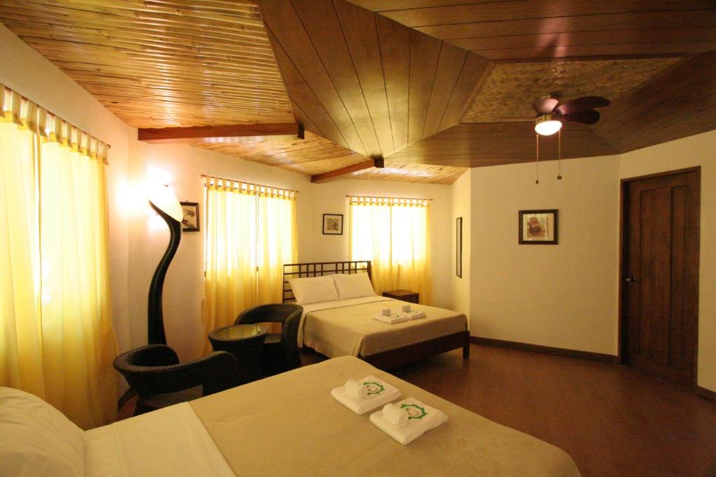 Postel nebo postele na pokoji v ubytování Coron Hilltop View Resort