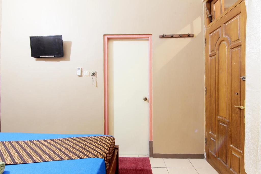 TV a/nebo společenská místnost v ubytování Monica Hotel Yogyakarta