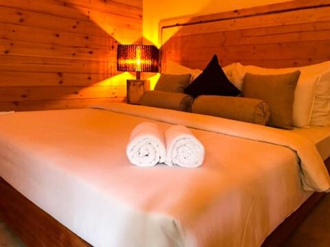 Postel nebo postele na pokoji v ubytování Trinco Relax Hut
