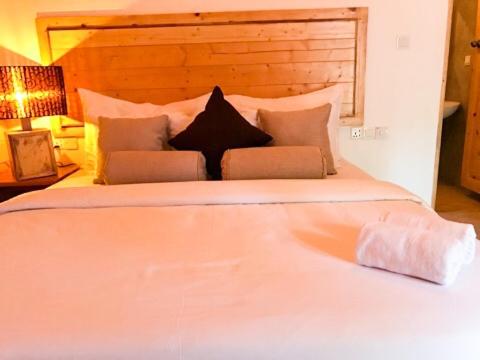 Postel nebo postele na pokoji v ubytování Trinco Relax Hut