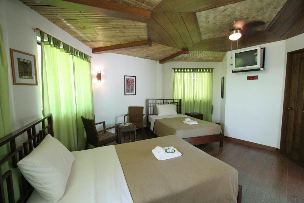 Postel nebo postele na pokoji v ubytování Coron Hilltop View Resort