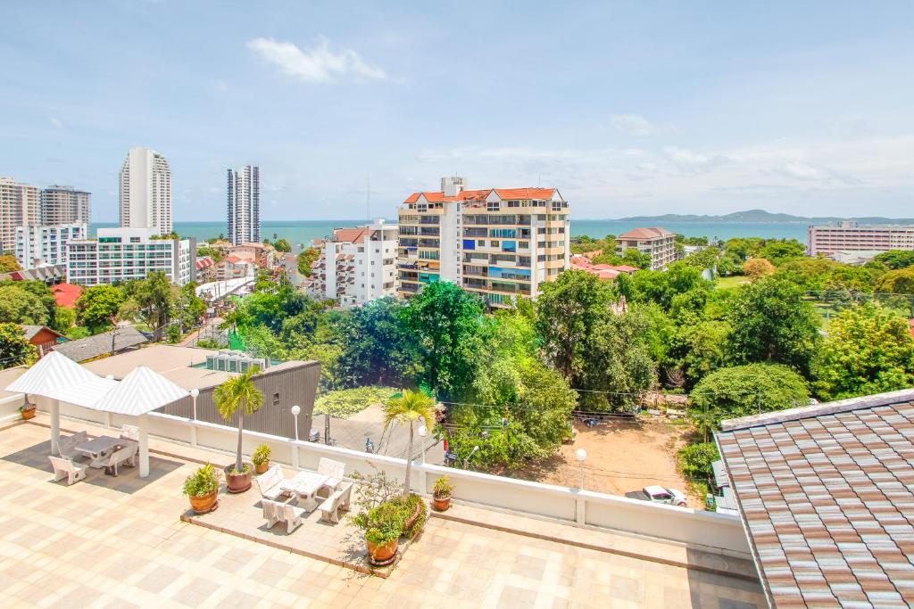 an apartment balcony with a view of a city at Jomtien Hill Resort Pratamnak in Pattaya South