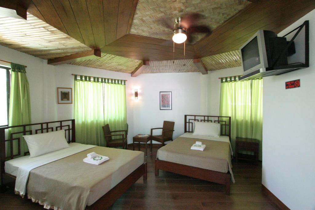 Postel nebo postele na pokoji v ubytování Coron Hilltop View Resort