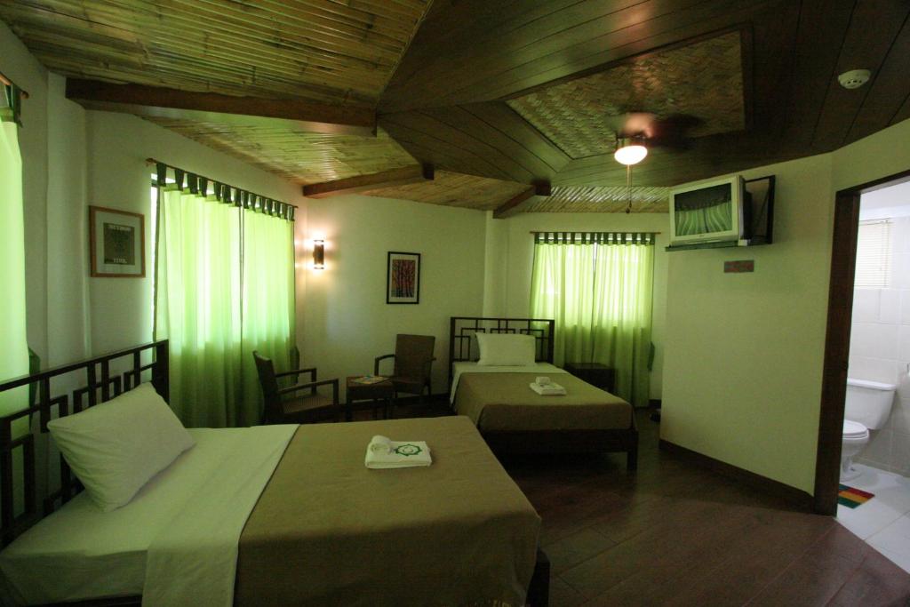 Postel nebo postele na pokoji v ubytování Coron Hilltop View Resort