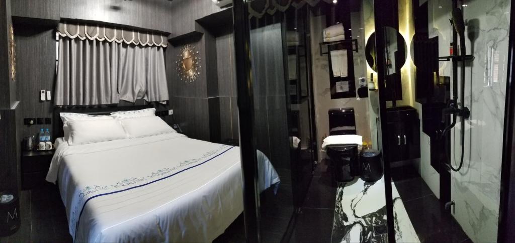 Postel nebo postele na pokoji v ubytování Star City Hotel