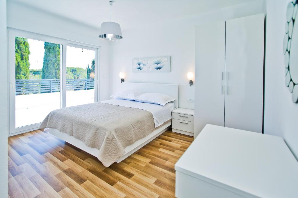 Ένα ή περισσότερα κρεβάτια σε δωμάτιο στο VILLA BLAŽEN