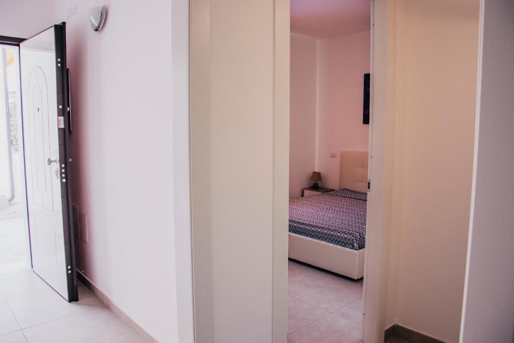 Postel nebo postele na pokoji v ubytování Milva's Apartment