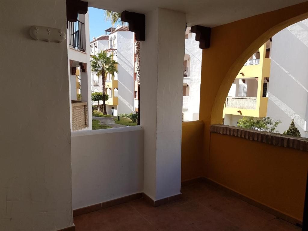 an empty hallway with two windows in a building at Apartamentos Atlanterra COSTA Y SOL in Zahara de los Atunes