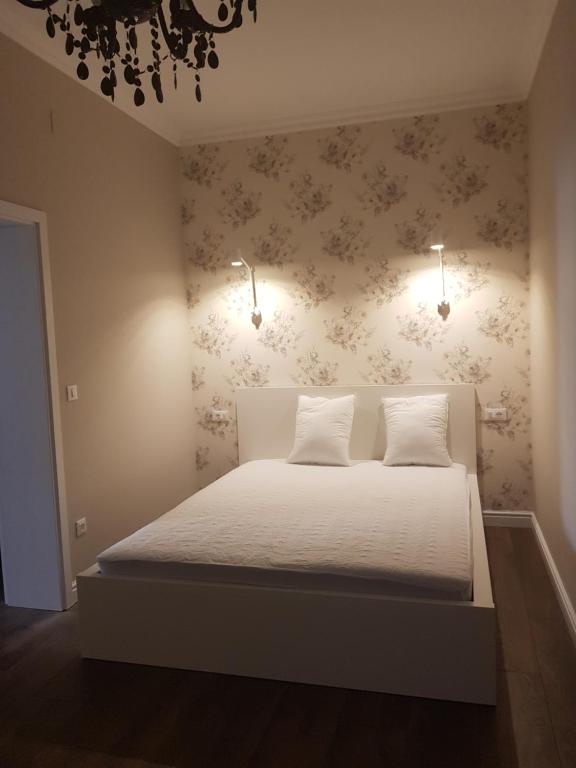 Postel nebo postele na pokoji v ubytování Apartments Lorenco