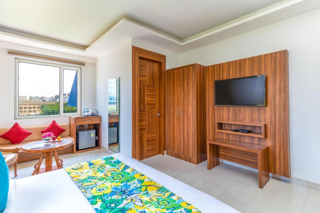 TV a/nebo společenská místnost v ubytování Inde Hotel Cyber City
