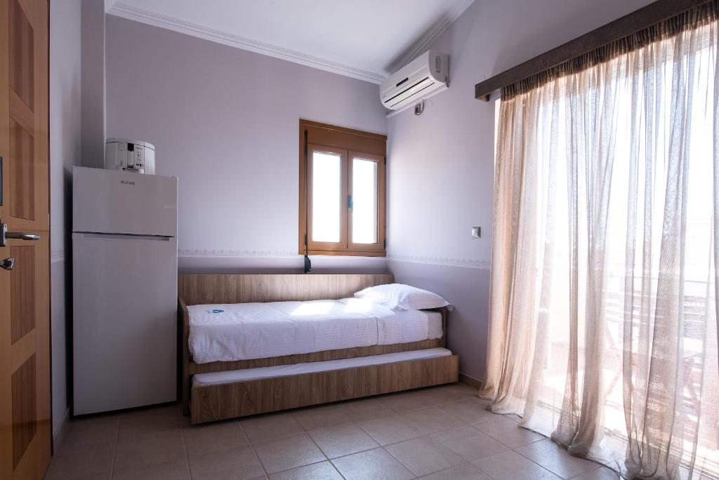Postel nebo postele na pokoji v ubytování Cyrenia Guesthouse