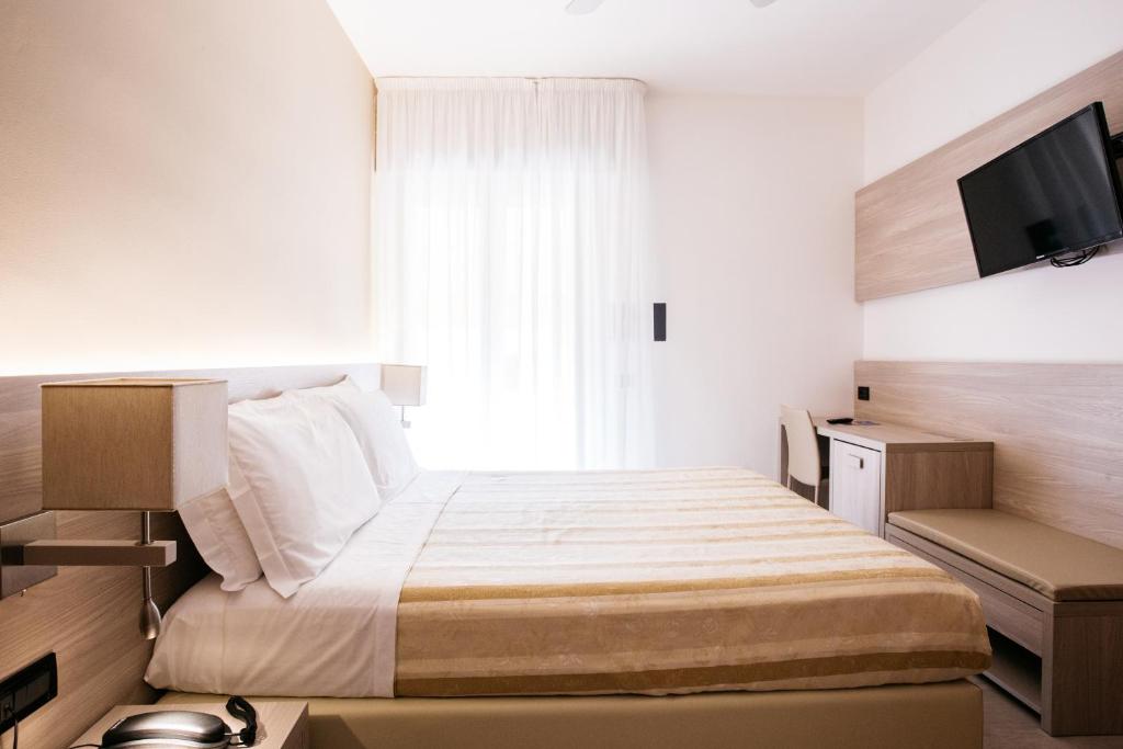 Postel nebo postele na pokoji v ubytování Hotel Angelo