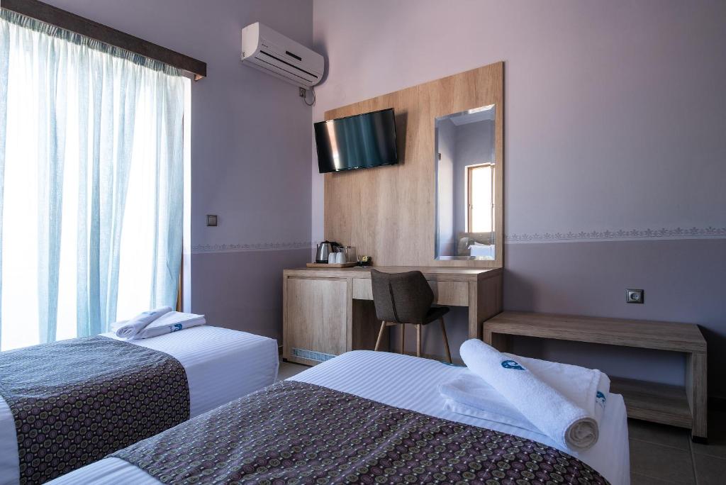 Postel nebo postele na pokoji v ubytování Cyrenia Guesthouse