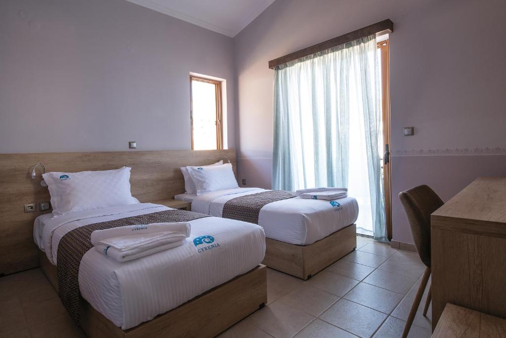 Postel nebo postele na pokoji v ubytování Cyrenia Guesthouse