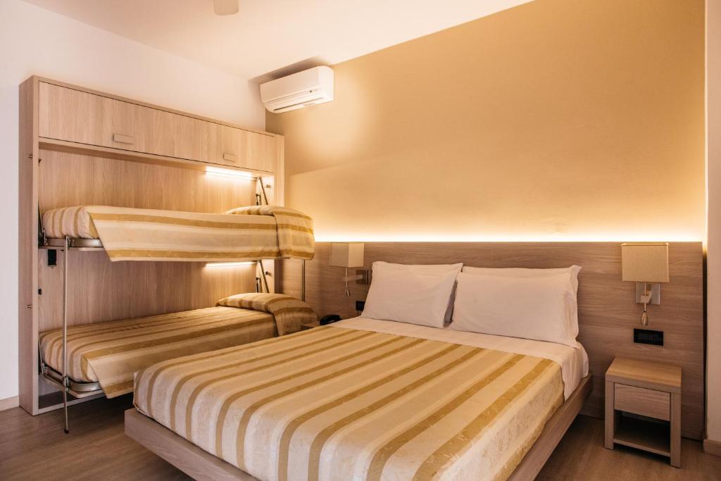 Postel nebo postele na pokoji v ubytování Hotel Angelo