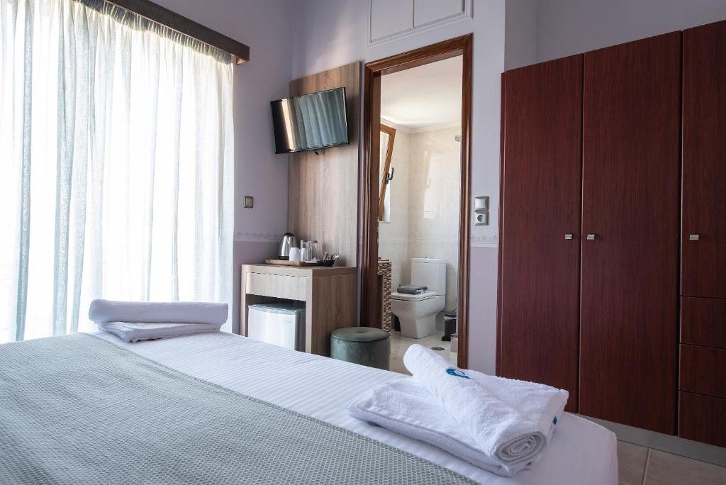 Postel nebo postele na pokoji v ubytování Cyrenia Guesthouse