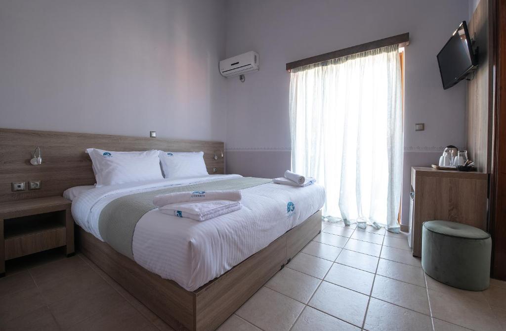 Postel nebo postele na pokoji v ubytování Cyrenia Guesthouse