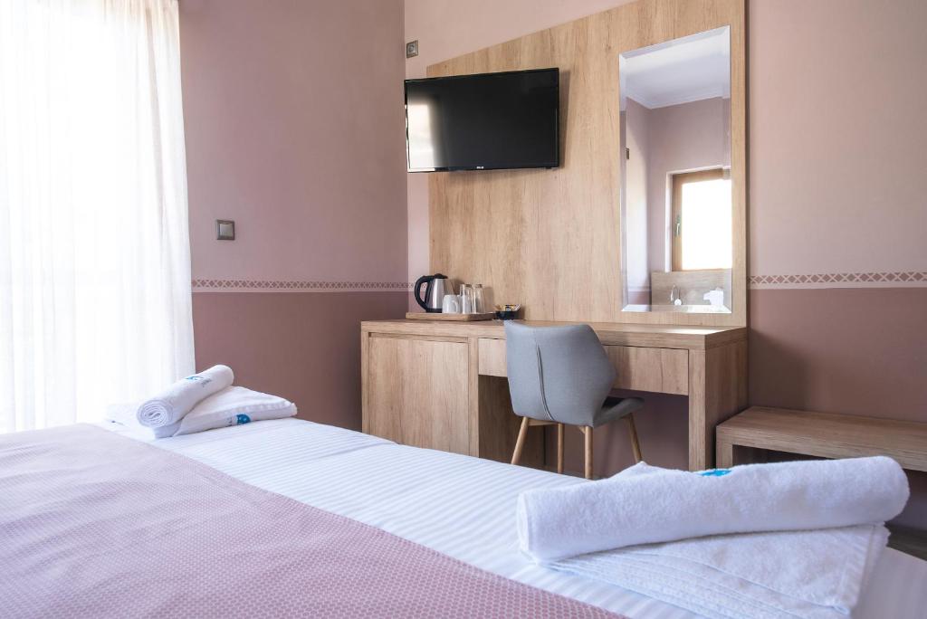 Postel nebo postele na pokoji v ubytování Cyrenia Guesthouse