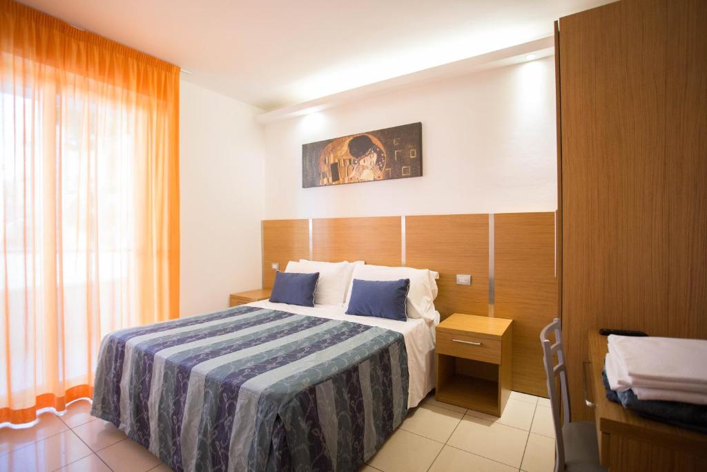 Säng eller sängar i ett rum på Residence Marzia