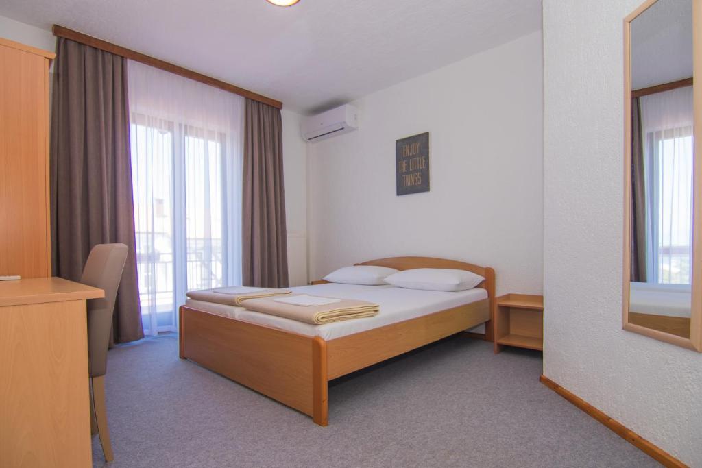 Postel nebo postele na pokoji v ubytování Villa Rustika
