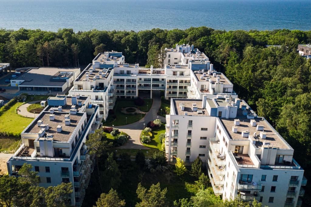 an aerial view of a building near the water at Apartamenty Aquamarina - visitopl in Międzyzdroje