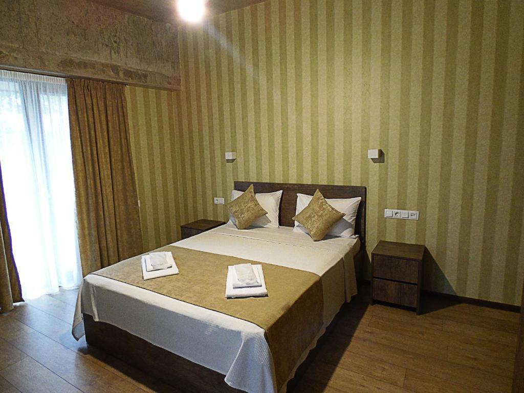 Posteľ alebo postele v izbe v ubytovaní Magic Hotel