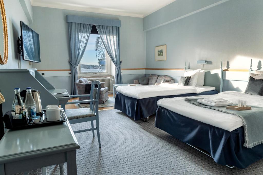 Postel nebo postele na pokoji v ubytování First Hotel Statt Örnsköldsvik
