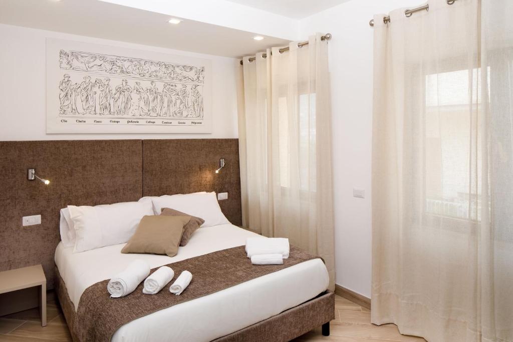 Postel nebo postele na pokoji v ubytování Le Muse Suite