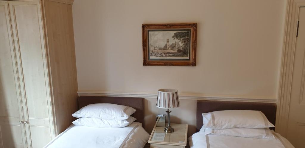 Postel nebo postele na pokoji v ubytování Highfield Guest House