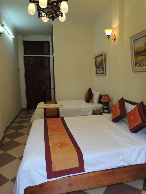 Postel nebo postele na pokoji v ubytování Hanoi Ecogreen Hostel
