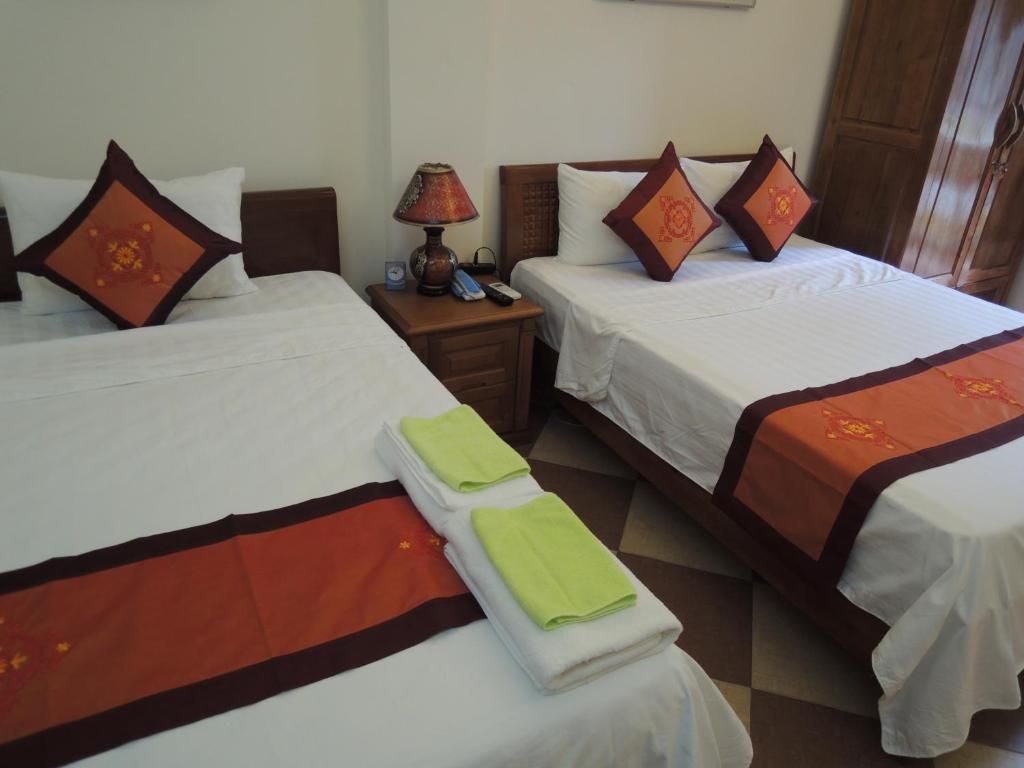 Postel nebo postele na pokoji v ubytování Hanoi Ecogreen Hostel