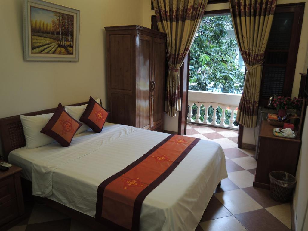Postel nebo postele na pokoji v ubytování Hanoi Ecogreen Hostel
